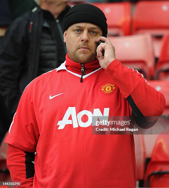 Manchester United fan is dejected after the Barclays Premier League match between Sunderland and Manchester United at the Stadium of Light on May 13,...