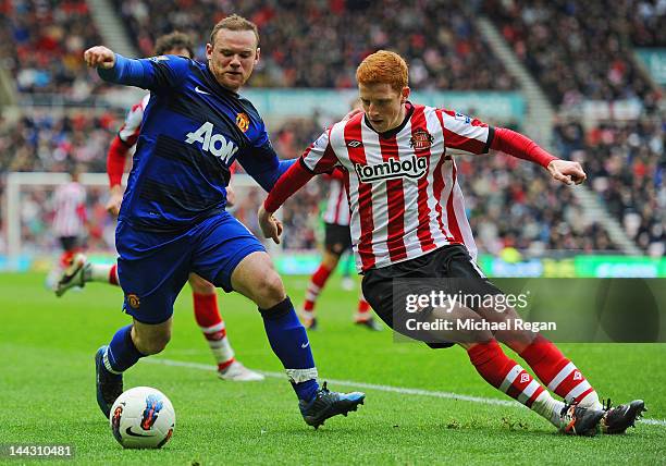 Wayne Rooney of Manchester United in action with Jack Colback of Sunderland during the Barclays Premier League match between Sunderland and...