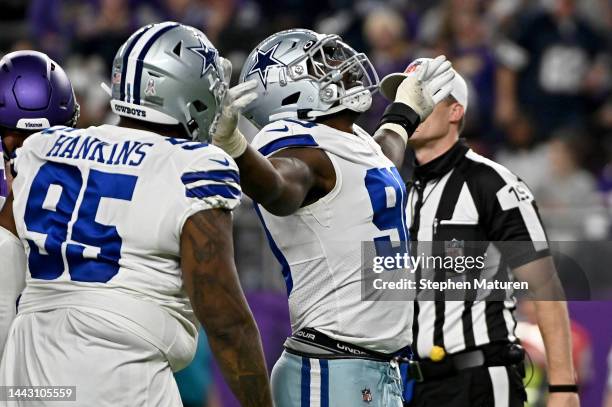 DeMarcus Lawrence of the Dallas Cowboys reacts during the second half against the Minnesota Vikings at U.S. Bank Stadium on November 20, 2022 in...