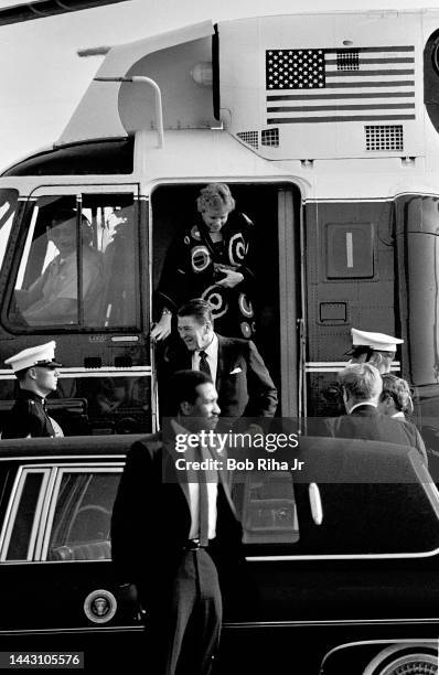 President Ronald Reagan arrives on MARINE One for a Republican fundraising event inside the 'Spruce Goose' geodesic dome alongside the RMS Queen...