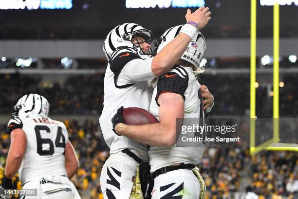 Joe Burrow of the Cincinnati Bengals hugs Trenton Irwin of the Cincinnati Bengals after Irwin's touchdown during the third quarter against the...