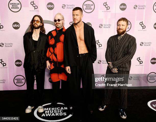 Daniel Wayne Sermón, Daniel Platzman, Dan Reynolds and Ben McKee of Imagine Dragons attend the 2022 American Music Awards at Microsoft Theater on...