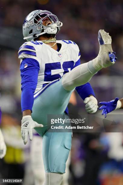 Dante Fowler Jr. #56 of the Dallas Cowboys celebrates after a sack during the third quarter against the Minnesota Vikings at U.S. Bank Stadium on...