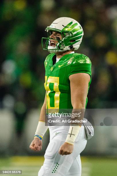 Quarterback Bo Nix of the Oregon Ducks celebrates after a successful field goal attempt during the first quarter of the game against the Utah Utes at...