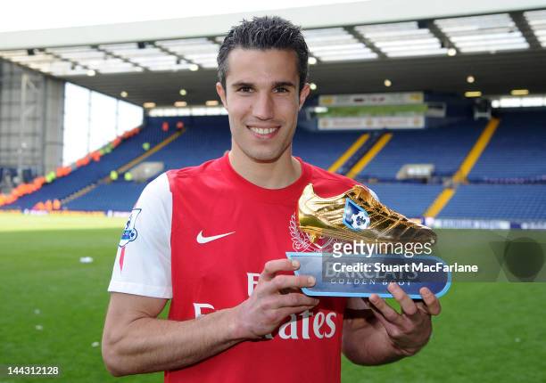 Robin van Persie of Arsenal poses with the golden boot after the Barclays Premier League match between West Bromwich Albion and Arsenal at The...