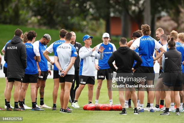 Kangaroos head coach Alastair Clarkson speaks to his players during a North Melbourne Kangaroos training session at Arden Street Oval on November 21,...