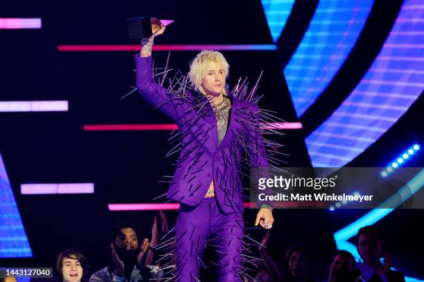 Machine Gun Kelly accepts the Favorite Rock Artist award onstage during the 2022 American Music Awards at Microsoft Theater on November 20, 2022 in...