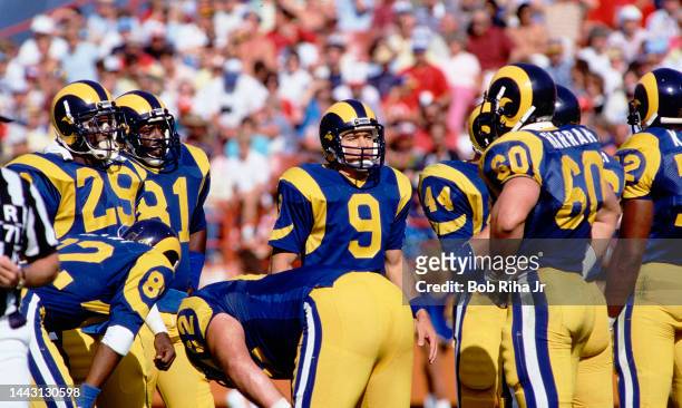 Los Angeles Rams QB Jeff Kemp speaks with teammates Eric Dickerson and Dennis Harrah during game action against San Francisco 49'ers, October 27,...