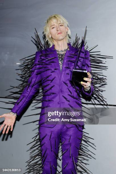 Machine Gun Kelly, winner of the Favorite Rock Artist award, poses in the press room during the 2022 American Music Awards at Microsoft Theater on...