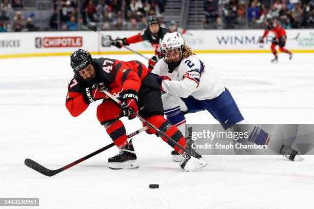 Jamie Lee Rattray of Team Canada and Lee Stecklein of Team United States battle for the puck during the second period at Climate Pledge Arena on...