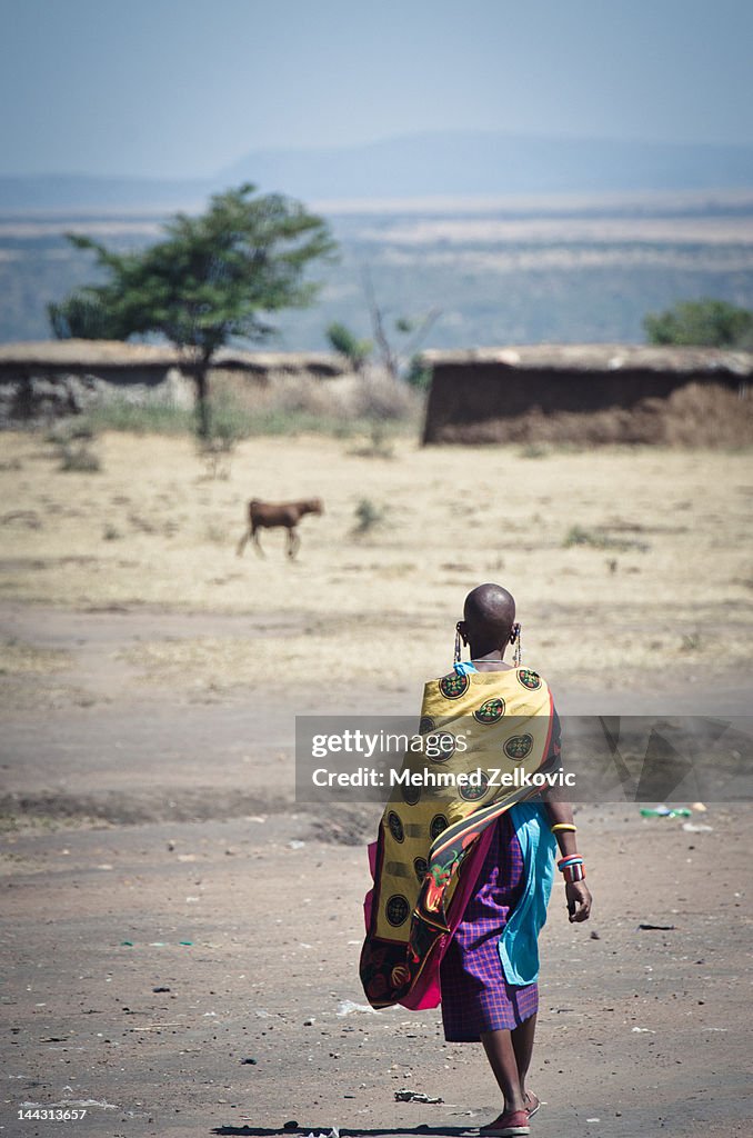 Masai woman walking away