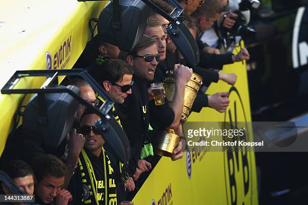 Roman Weidenfeller, head coach Juergen Klopp and Florian Kringe celebrate with the DFB cup during a parade at Borsigplatz celebrating Borussia...