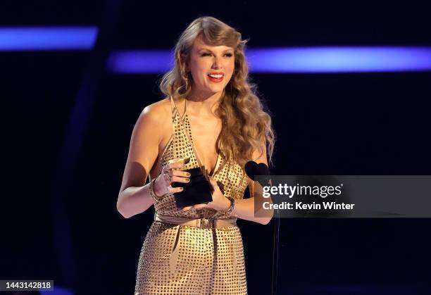 Taylor Swift accepts the Artist of the Year award onstage during the 2022 American Music Awards at Microsoft Theater on November 20, 2022 in Los...