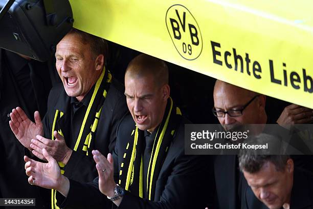 Chairman Hans-Joachim Watzke of Dortmund sings during a parade at Borsigplatz celebrating Borussia Dortmund's Bundesliga and DFB Cup win on May 13,...