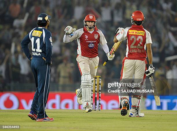 Kings XI Punjab batsman Gurkeet Mann Singh and his teammate David Hussey celebrate their team's victory over Deccan Chargers during the IPL Twenty20...