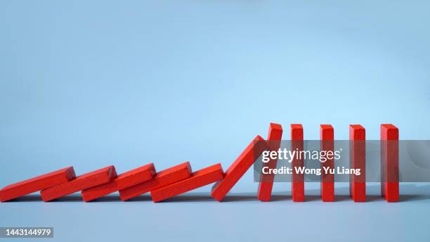 domino effect concept , economy recession crashing concept photo - dominoes stock pictures, royalty-free photos & images