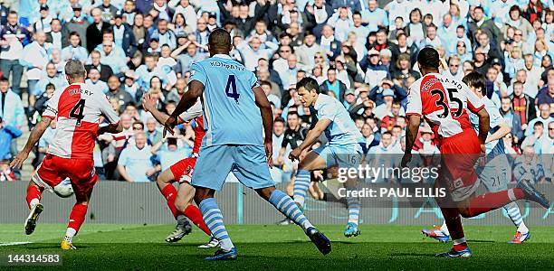 Manchester City's Argentinian striker Sergio Aguero scores their late winning goal during the English Premier League football match between...