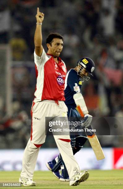 Kings XI Punjab bowler Azhar Mehmood celebrates after dismissal of Deccan Chargers batsman Parthiv Patel during the IPL T20 cricket match played...