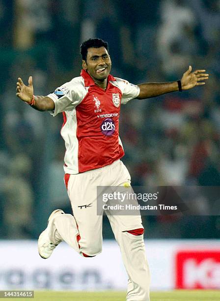 Kings XI Punjab bowler Parvinder Awana celebrates after dismissal of Deccan Chargers captain Kumar Sangakkara during the IPL T20 cricket match played...