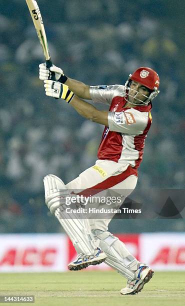 Kings XI Punjab batsman Azhar Mehmood plays a shot during the IPL T20 cricket match played between Kings XI Punjab and Deccan Chargers at PCA Stadium...