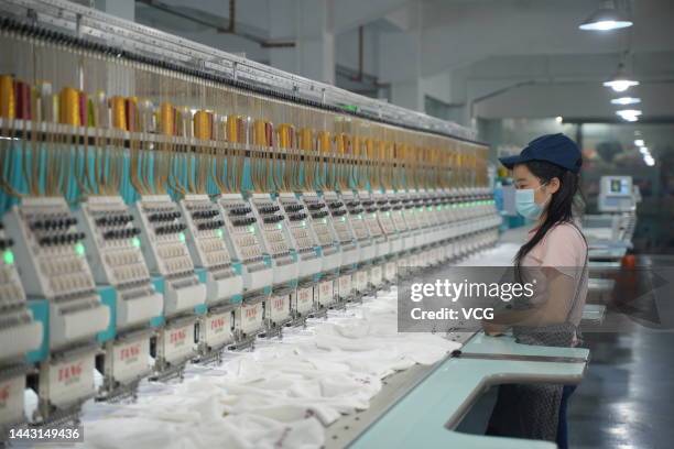 Employee make headdresses of the FIFA World Cup Qatar 2022 mascot La'eeb at a factory on November 15, 2022 in Dongguan, Guangdong Province of China.