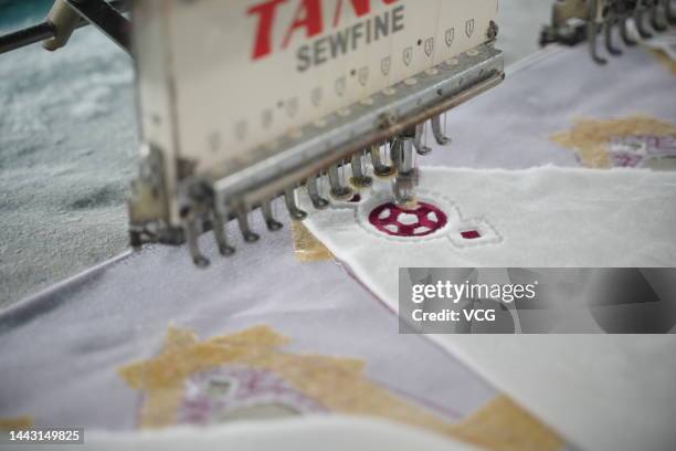 Employee make headdresses of the FIFA World Cup Qatar 2022 mascot La'eeb at a factory on November 15, 2022 in Dongguan, Guangdong Province of China.