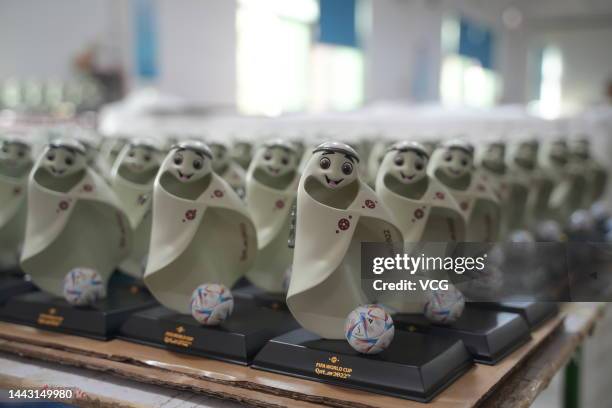 Employee make figurines of the FIFA World Cup Qatar 2022 mascot La'eeb at a factory on November 15, 2022 in Dongguan, Guangdong Province of China.