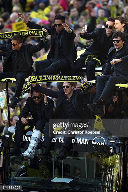 The team of Dortmund celebrates with the trophies during a parade at Borsigplatz celebrating Borussia Dortmund's Bundesliga and DFB Cup win on May...