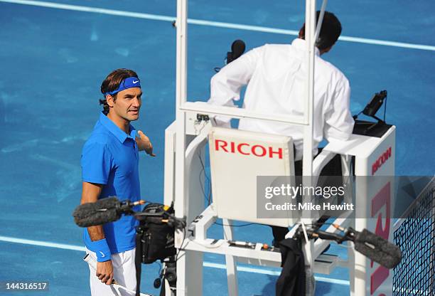 Roger Federer of Switzerland has a disagreement with the umpire during hs match against Tomas Berdych of Czech Republic in the Men's Single Final on...