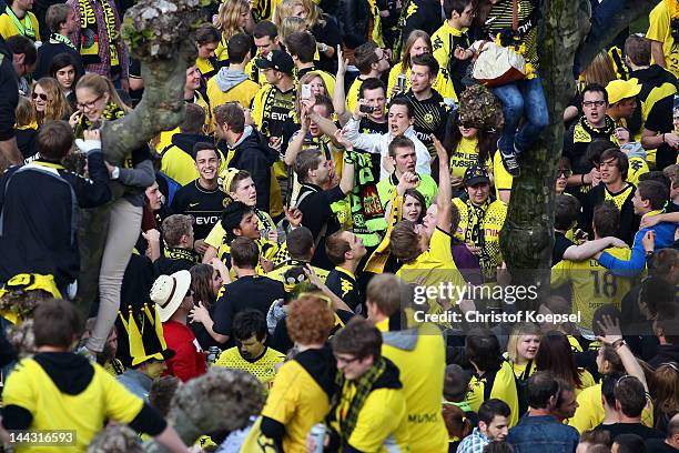 Fans of Dortmund celebrate during a parade at Borsigplatz celebrating Borussia Dortmund's Bundesliga and DFB Cup win on May 13, 2012 in Dortmund,...