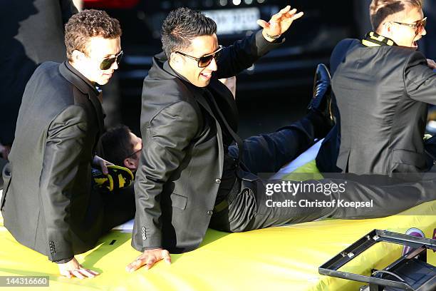 Ivan Perisic, Lucas Barrios and Jakub Blaszczykowski of Dortmund celebrate during a parade at Borsigplatz celebrating Borussia Dortmund's Bundesliga...