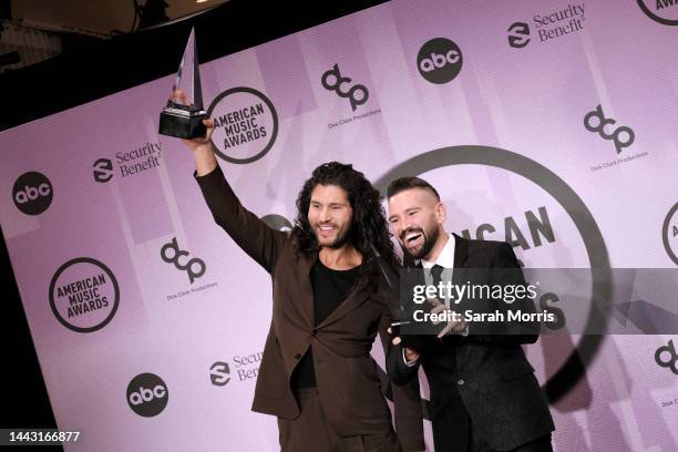 Dan Smyers and Shay Mooney of Dan + Shay, winner of the Favorite Country Duo or Group award, pose in the press room at the 2022 American Music Awards...