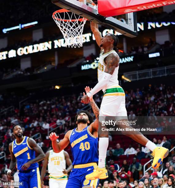 Jalen Green of the Houston Rockets dunks the ball during the game against the Golden State Warriors at Toyota Center on November 20, 2022 in Houston,...