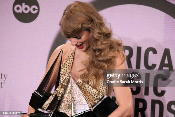 Taylor Swift, winner of Favorite Pop Album, Favorite Female Pop Artist, Favorite Music Video, Favorite Country Album, Favorite Female Country Artist,...