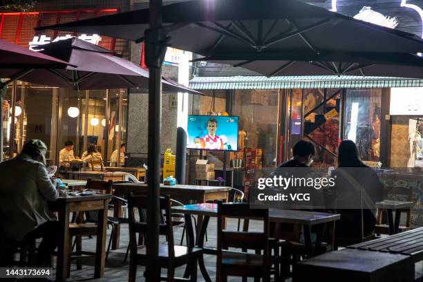 People prepare to watch the opening ceremony of FIFA World Cup Qatar 2022 at a pub on November 20, 2022 in Shanghai, China.