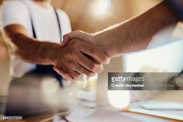 successful agreement at construction site! - handshake stock pictures, royalty-free photos & images