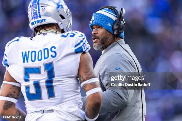 Assistant head coach and running backs coach Duce Staley speaks with Josh Woods of the Detroit Lions during the second quarter of the game against...