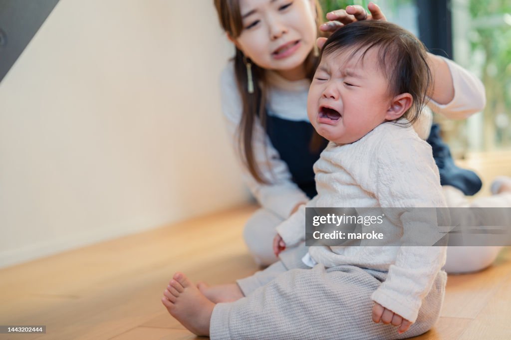 Babysitter nursing a crying baby