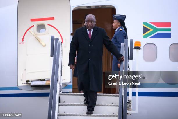 South African President Cyril Ramaphosa disembarks from his place as he arrives at Stansted Airport on November 21, 2022 in Stansted, England. The...