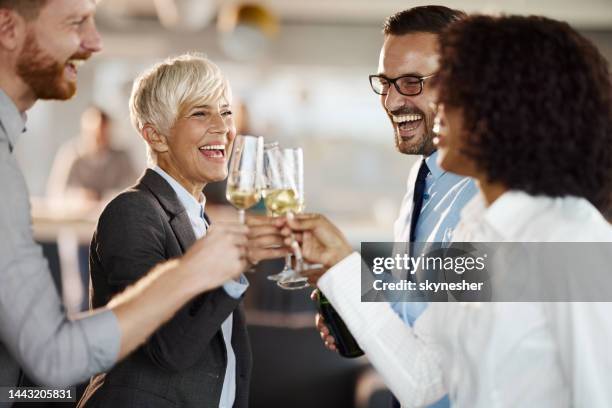 toasting with champagne at office party! - cheers champagne imagens e fotografias de stock