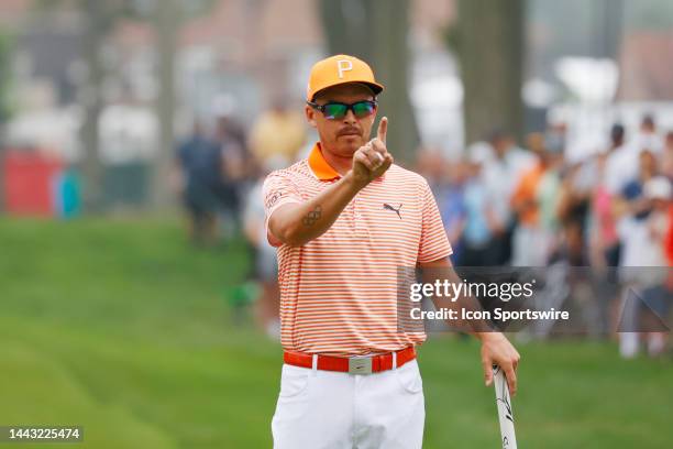 Golfer Rickie Fowler lines up his putt on the first hole on July 2 during the final round of the Rocket Mortgage Classic at the Detroit Golf Club in...