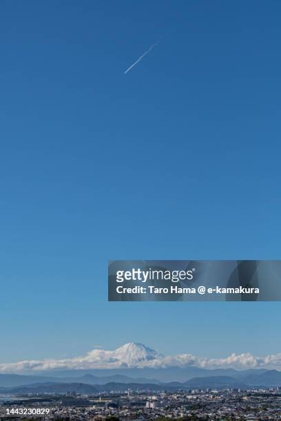 the airplane flying over snowcapped mt. fuji in japan - narita city stock pictures, royalty-free photos & images