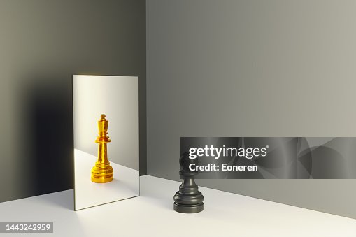 Chess pawn in a mirror reflecting himself as a king Chess pawn in a mirror reflecting himself as a king