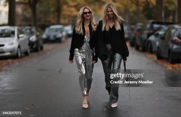 Sue Giers seen wearing SoSUE Blouse Shiny Black, silver Zara heels, Halston silver shiny jumpsuit, Vintage YSL black sunglasses and Antonia seen...