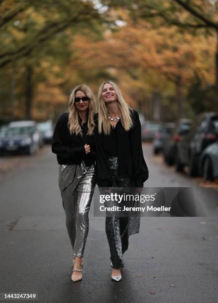 Sue Giers seen wearing SoSUE Blouse Shiny Black, silver Zara heels, Halston silver shiny jumpsuit, Vintage YSL black sunglasses and Vanessa Giers...