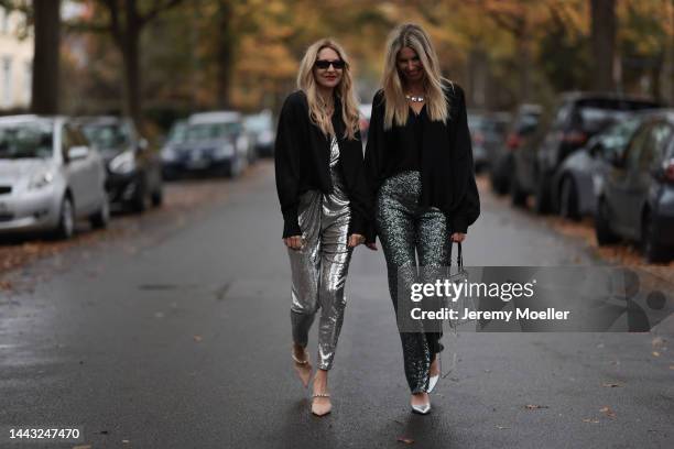 Sue Giers seen wearing SoSUE Blouse Shiny Black, silver Zara heels, Halston silver shiny jumpsuit, Vintage YSL black sunglasses and Vanessa Giers...