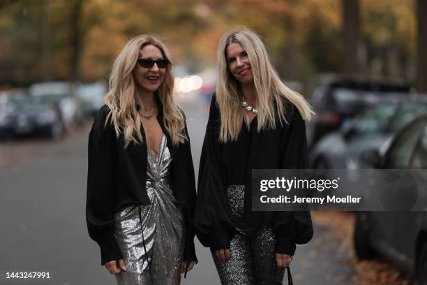 Sue Giers seen wearing SoSUE Blouse Shiny Black, silver Zara heels, Halston silver shiny jumpsuit, Vintage YSL black sunglasses and Vanessa Giers...