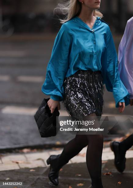 Marlene Fey seen wearing light purple blouse SoSUE Antonia, H&M glitter skirt, VeeCollective beige handbag, Zara earrings, Dr. Martens black loafer...