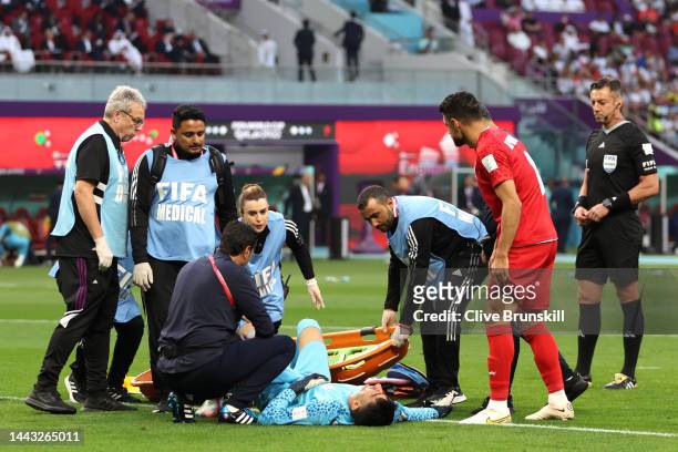Alireza Beiranvand of IR Iran receives medical treatment during the FIFA World Cup Qatar 2022 Group B match between England and IR Iran at Khalifa...