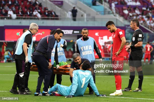 Alireza Beiranvand of IR Iran receives medical treatment during the FIFA World Cup Qatar 2022 Group B match between England and IR Iran at Khalifa...